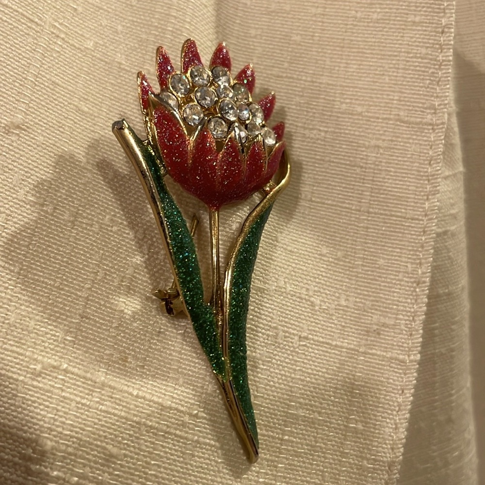 Flower brooch with colorful stones.